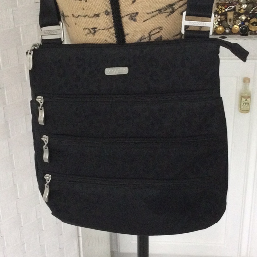 Woman’s Bazzllini Crossbody Bag color black 4 zipper compartments in front